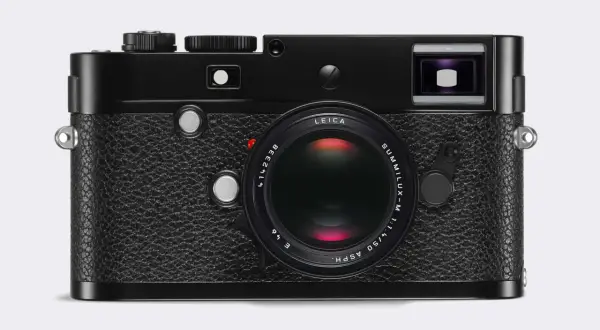 A classic black Leica 240 camera with a Summilux-M 50mm f/1.4 ASPH lens. This iconic camera is ready to capture timeless moments.