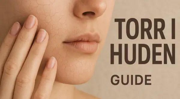 Nära bild på ansikte med torr hud som spricker. En hand rör vid kinden. Text: Torr i huden Guide.
