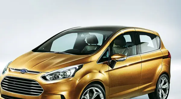 Złoty Ford B-Max z czarnym dachem, prezentujący nowoczesny design i przestronne wnętrze.