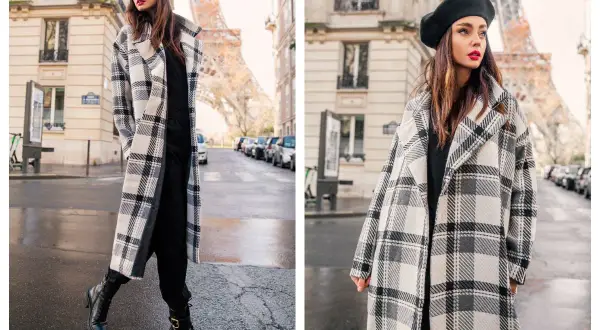 Elegancki płaszczyk plus size w kratę, idealny na paryski spacer. Kobieta w beretce i długim płaszczu na tle Wieży Eiffla.