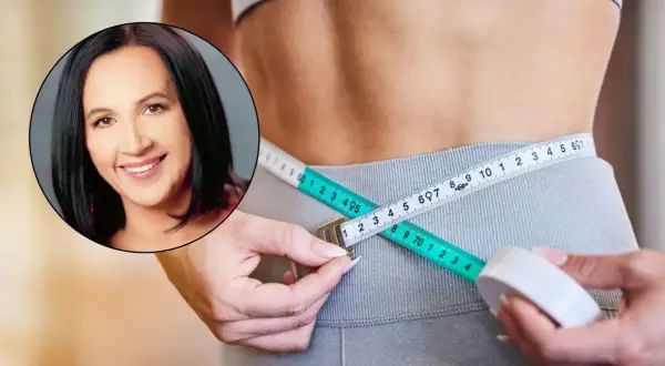 Uśmiechnięta kobieta i miarka krawiecka na talii. Dieta 1200 kcal efekty po 2 tygodniach są widoczne!