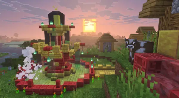 Wioska w Minecraft z nową aktualizacją. W centrum budowla z czerwonych i złotych bloków, obok krowa i domki.