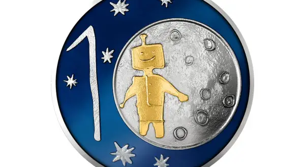 Złoty robot na Księżycu, obok cyfry 1 i gwiazdek. Taka grafika może pojawić się na monecie wyprodukowanej przez mennicę.