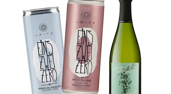 Två burkar alkoholfritt mousserande vin och en flaska vin. Perfekt vin till lax, oavsett om du väljer Riesling eller Rosé.