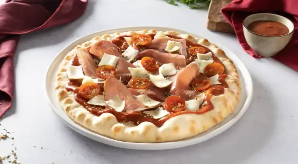 Pizza jambon cru parfaite : le secret pour une saveur intacte
