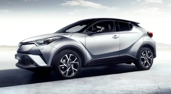 Silver Toyota C-HR hybrid, elegant design, ready for any journey. A stylish car, but some owners report a minor toyota chr problem with the infotainment system.