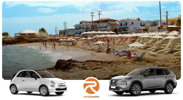 Dwa samochody, biały Fiat 500 i srebrny SUV, stoją przed grecką plażą z leżakami i parasolami. Idealne na wakacyjne **gouves**!