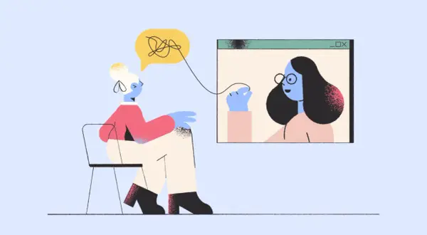 Kobieta na krześle rozmawia przez wideo z drugą osobą. Czy to jest terapia, czyli tsr co to?