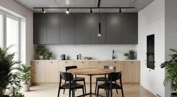 Nowoczesna kuchnia z wyspą, okrągłym stołem i krzesłami. Nad nimi wisi elegancka lampa led slim, oświetlając wnętrze.