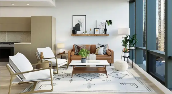 A modern traditional interior design featuring a brown leather sofa, white armchairs, and a geometric rug.