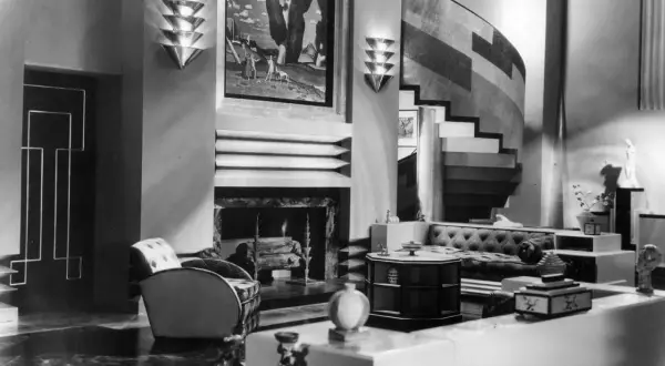 A luxurious Art Deco living room, showcasing the bold geometric style of the era's artists.