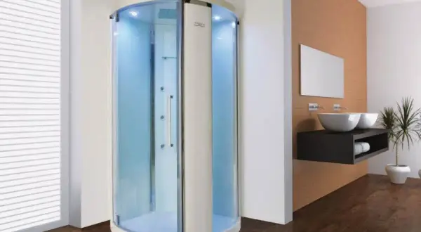 Une cabine de douche moderne avec éclairage bleu, offrant une expérience de douche sensorielle relaxante.