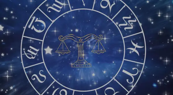 Zodiakalny krąg z symbolem Wagi w centrum. Wokół widoczne inne znaki powietrzne i gwiezdne tło.