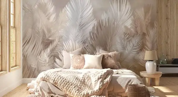 Eleganckie aranżacje sypialni z tapetą w liście paproci tworzą przytulną atmosferę. Miękkie tekstylia i naturalne materiały dopełniają całość.