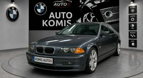 Szary sedan BMW 3 (E46) z 2002 roku, prezentowany w komisie samochodowym.