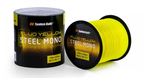 Jasnożółty monofilament "Steel Mono" Tandem Baits na szpulce i w opakowaniu. Idealny do dalekich rzutów.