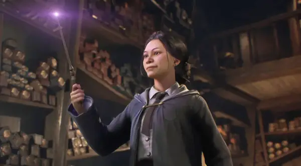 Dziewczyna z różdżką w sklepie z różdżkami, inspiracja do gry Hogwarts Legacy poradnik.
