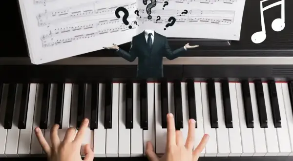 Dziecko gra na pianinie, a nad klawiaturą unosi się garnitur z pytajnikami. Czy to trudny utwór, czy może chodzi o efekt tremolo?