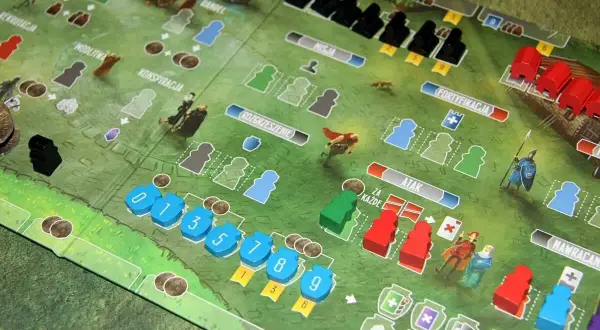 Paladyni zachodniego królestwa przygotowują się do bitwy na planszy gry strategicznej.
