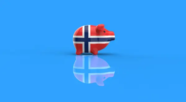 Skarbonka w barwach flagi Norwegii, symbolizująca konto walutowe w koronach norweskich.