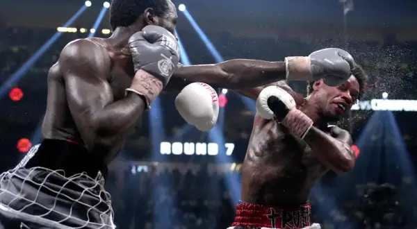 Boxer lands a powerful punch, showcasing one of the best shadow boxing finishers. The crowd roars as Round 7 begins.