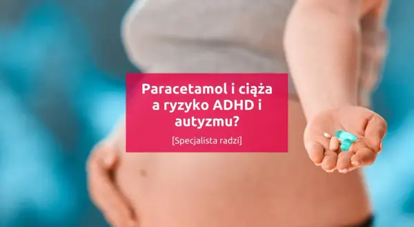 Dłoń kobiety w ciąży trzymająca tabletki.