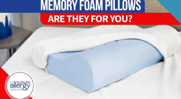 A blue memory foam pillow with a white cover, on a white sheet. Text reads "MEMORY FOAM PILLOWS ARE THEY FOR YOU?". Discover memory foam pillow benefits.
