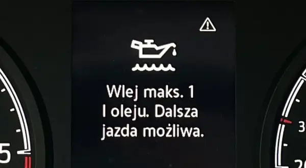 Kontrolka oleju z falą: "Wlej maks. 1 l oleju. Dalsza jazda możliwa." ostrzega o niskim poziomie oleju.