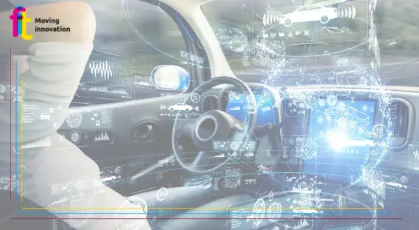 Interno di un'auto con interfaccia futuristica che mostra dati e grafici, simboleggiando la guida autonoma e l'innovazione tecnologica.