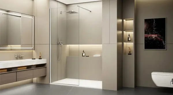 Salle de bain moderne avec un grand miroir lumineux, un lavabo suspendu et une spacieuse cabine de ressaut douche en verre.