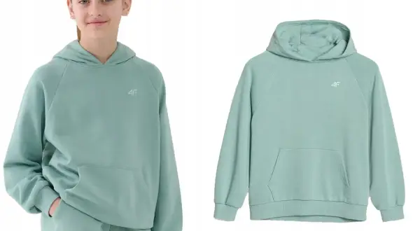 Dziewczynka w miętowej bluzie oversize z kapturem i kieszenią kangurką. Obok bluza bez modelki.