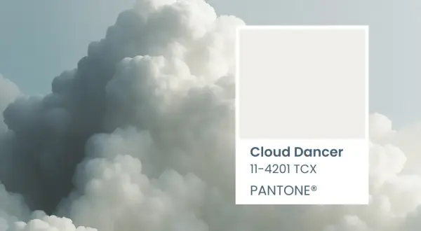 A soft, ethereal cloud formation, reminiscent of a cloud dancer, is paired with the Pantone color swatch for Cloud Dancer 11-4201 TCX.