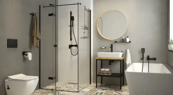 Nowoczesna łazienka z wanną, prysznicem i umywalką. Zastanawiasz się, bidet co to? To urządzenie do higieny intymnej, które może być osobnym elementem lub funkcją toalety.