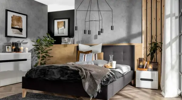 Nowoczesna, szara sypialnia inspiracje. Betonowa ściana, drewniane akcenty i minimalistyczne meble tworzą przytulną atmosferę.