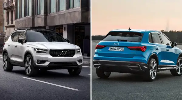 Jämförelse av en vit Volvo XC40 och en blå Audi Q3. En audi q3 test visar dessa två SUV:ar sida vid sida.