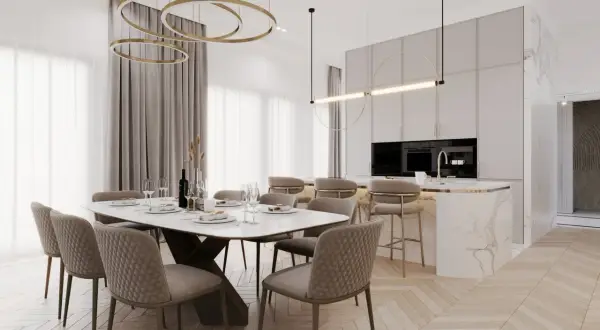 Elegancka jadalnia i kuchnia w stylu modern classic z marmurową wyspą i złotymi akcentami.