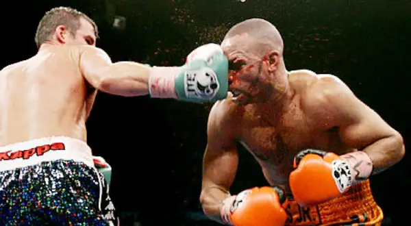 A boxer lands a punch on his opponent's face during the Joe Calzaghe vs Roy Jones Jr. fight.