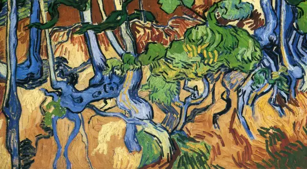 Wyrzeźbione przez naturę, niebieskie pnie drzew splatają się w żywym krajobrazie. Vincent van Gogh ciekawostki: jego dzieła pełne są emocji.