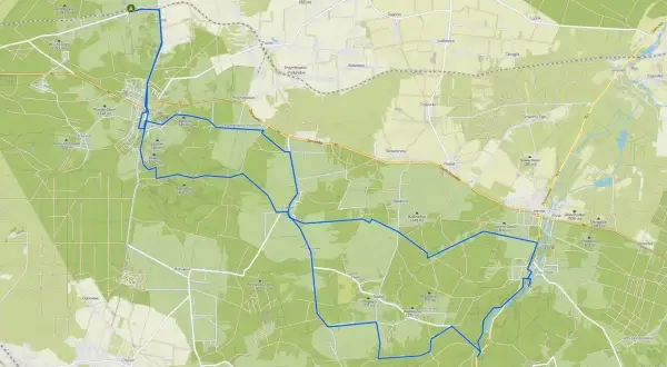 Mapa z zaznaczonymi szlakami rowerowymi wokół Olsztyna, prowadzącymi przez lasy i tereny pagórkowate.
