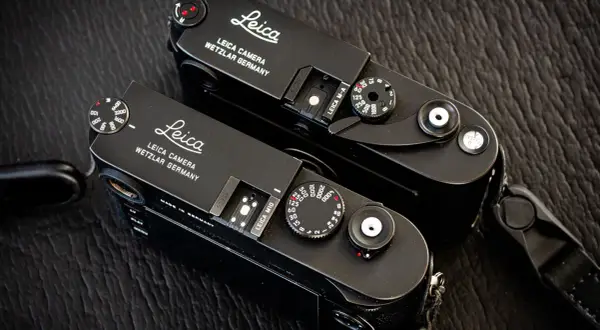 Two black Leica M cameras, ready for detailed Leica lenses reviews.