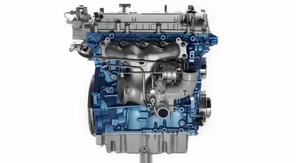 Silnik 1.9 TDI z niebieskim blokiem i turbosprężarką.