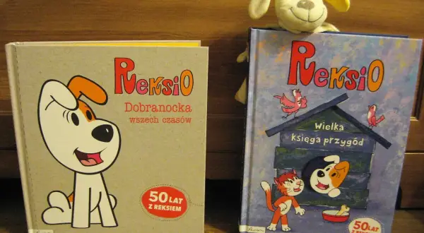 Dwie książki z Reksio: "Dobranocka wszech czasów" i "Wielka księga przygód". Na okładce drugiej widać Reksia w budzie i kota.