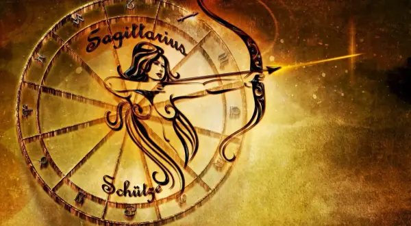 Znak zodiaku Strzelec, symbolizowany przez łucznika z łukiem i strzałą, w złotej oprawie zodiakalnego koła.