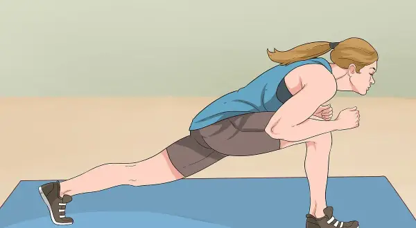 Woman performing a dynamic jumping lunges exercise on a blue mat, demonstrating proper form for an explosive workout.