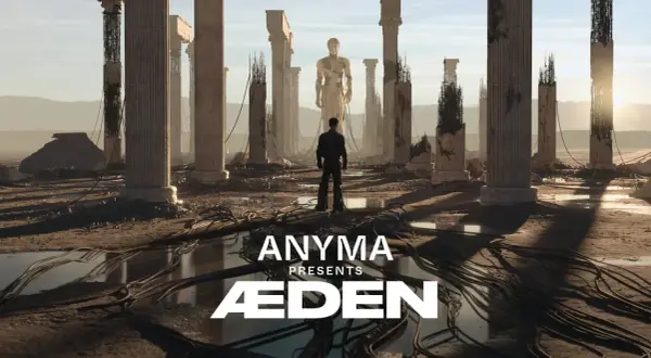 Mężczyzna stoi przed ruinami starożytnych kolumn, patrząc na gigantyczny posąg. Anyma Presents ÆDEN – zapowiedź koncertu.