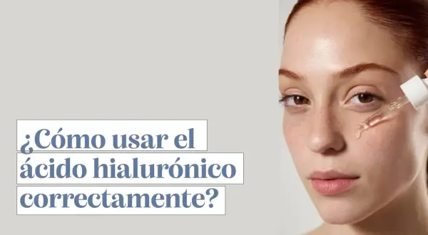 Una mujer joven recibe gotas de ácido hialurónico en su cara. El texto pregunta: "¿Cómo usar el ácido hialurónico correctamente?".