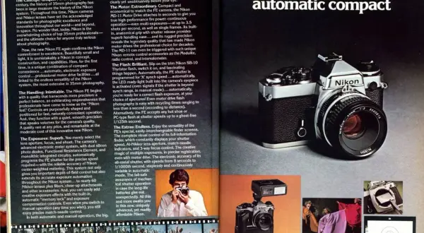 A vintage Nikon FE camera with a Nikkor lens, showcasing its classic design and advanced features for photographers.