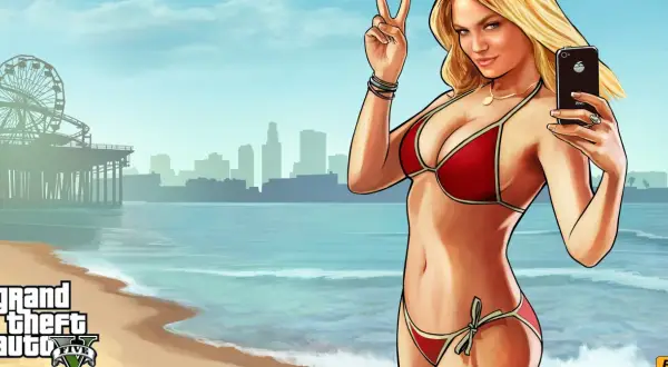 Kobieta w czerwonym bikini robi selfie na plaży z widokiem na miasto i diabelski młyn.