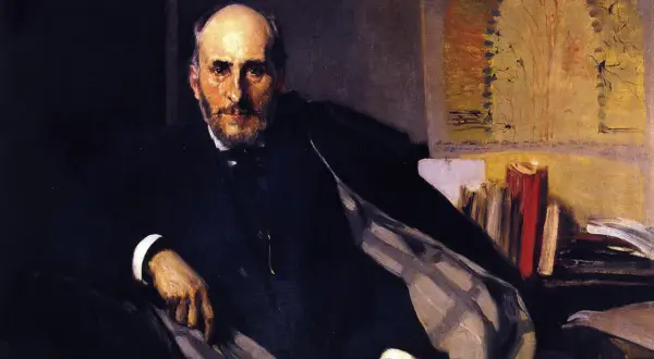 Retrato de Ramón de la Sagra, hombre de barba y traje oscuro, sentado con libros detrás.