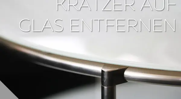 Anleitung: Kratzer im Glas entfernen. Nahaufnahme einer Glasplatte mit Metallrahmen.